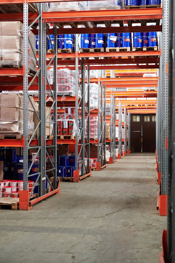 services-04 Industrial warehouse interior with organized shelves stacked with packages and goods.